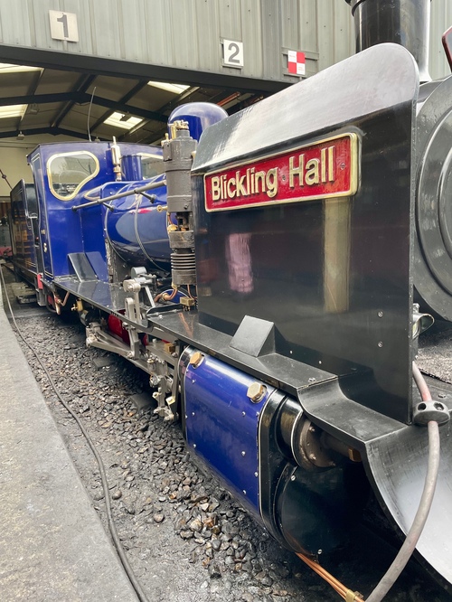 Looking down the side of the dark blue engine at a jaunty angle. I’m right up close to its side, so the train fills the photo.